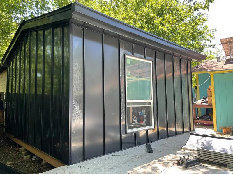 Black standing seam metal wall panels for Metal Roof Installation in Moreau