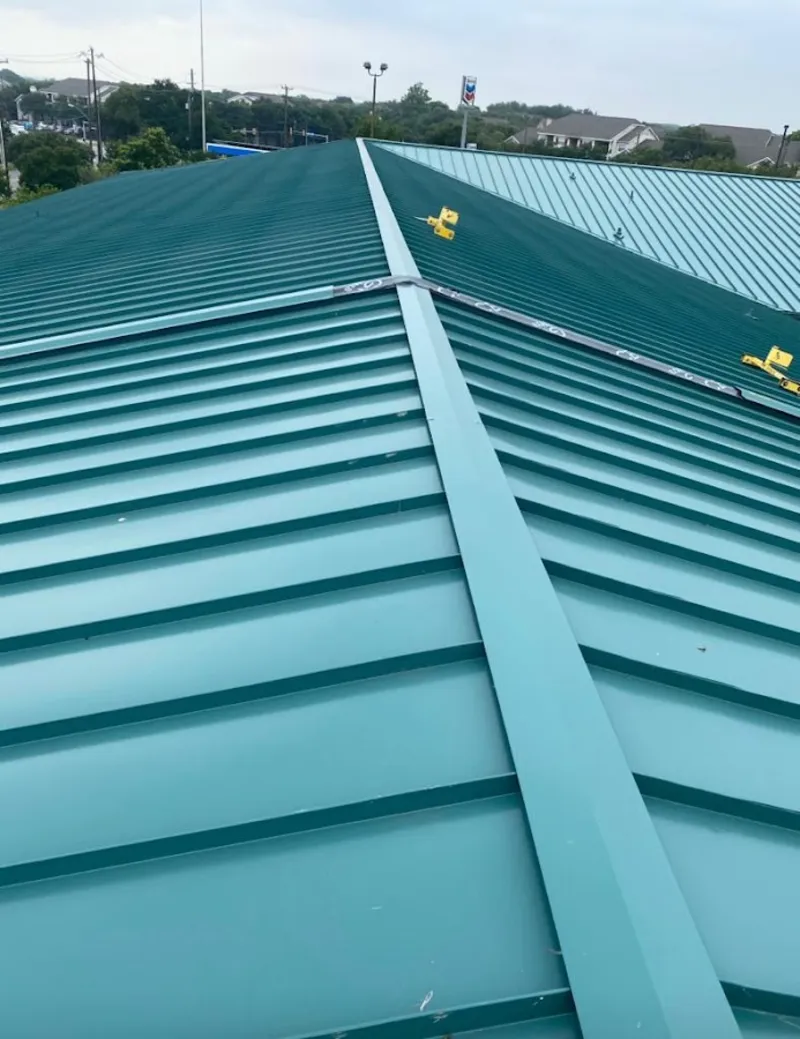 Green commercial metal roof ridge and valley for Metal Roof Repair in Moreau